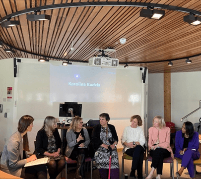 Photo of EBS International Women’s Day event Chair and Panellists in action. From left to right the Chair Dr. Anna Sarkisyan, Alumni Claire Penketh, Professor Claudia Girardone, Student Services Advisor Teresa Alvarez, Alumni Bridget Connell and Sam Honey, and Leila Thomas the CEO of Urban Synergy.