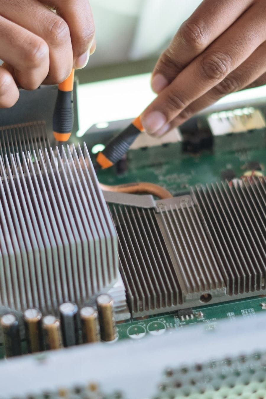 Hands fixing circuit board close-up shot