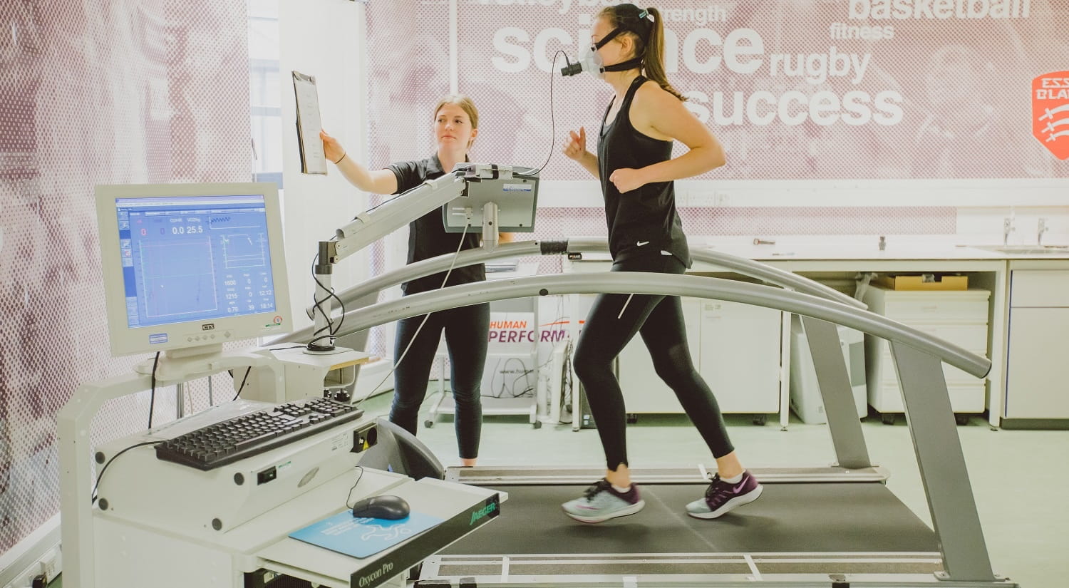 Woman running on treadmill in the sports arena lab