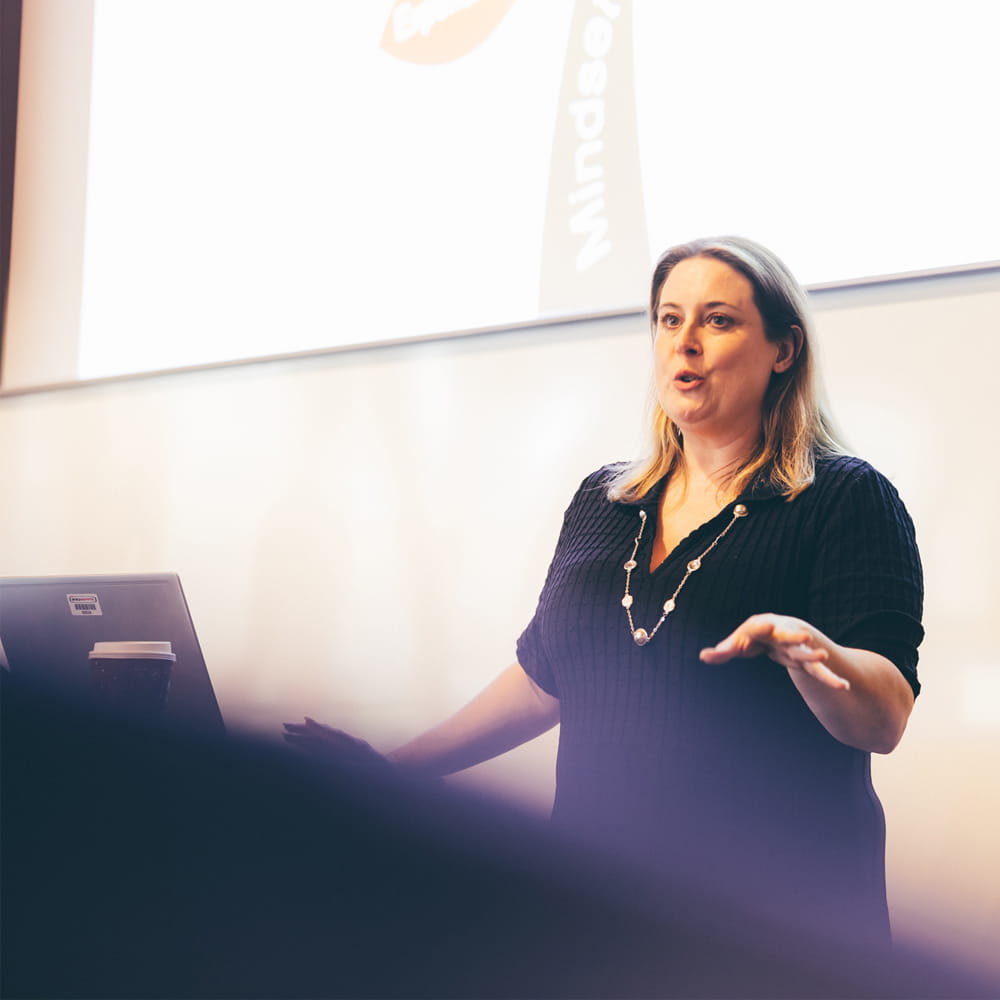 Female speaker from Innoapps giving a presentation to MBA students 