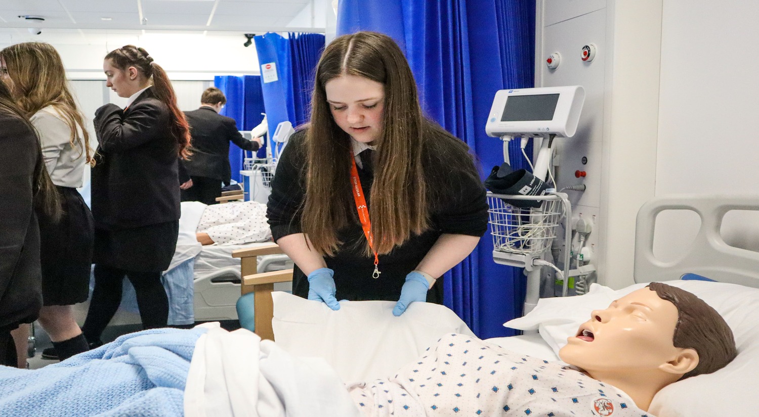 A student learns how to find vital life signs