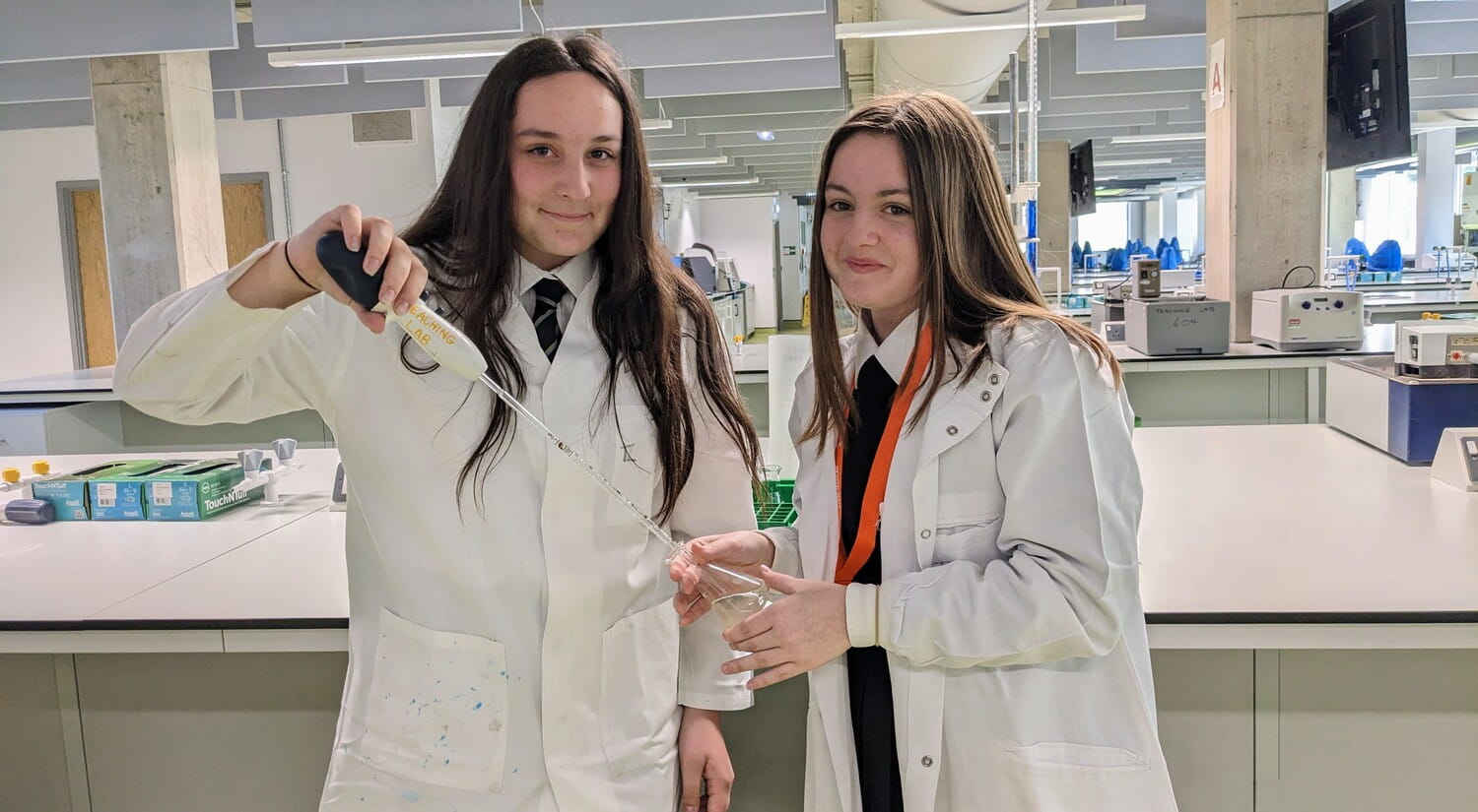 Two students learn about chemistry