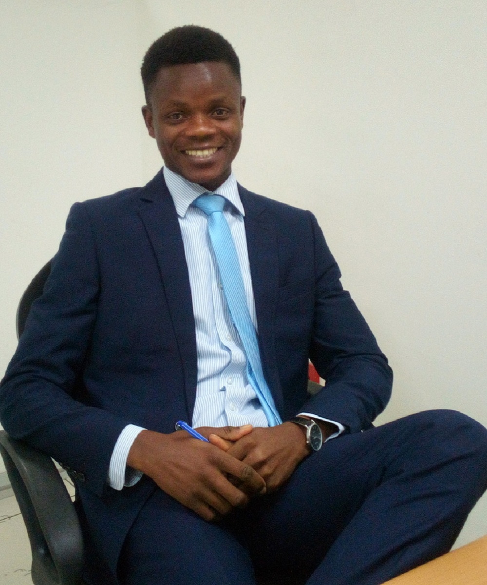 Portrait of Economics graduate Emmanuel Akoteyon.