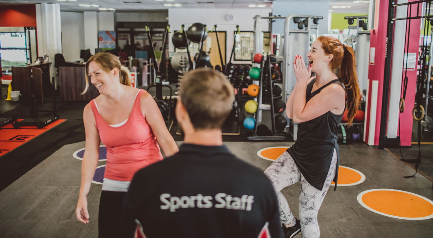 Two people enjoying a personal training session in the gym