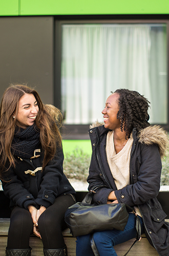 Two students laughing 