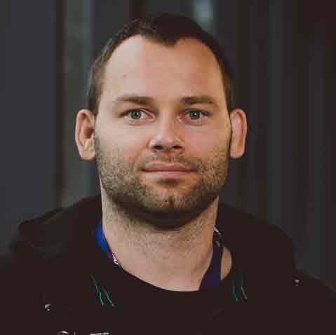 Dr Jozef Simenko wearing a dark jacket over a dark sweater