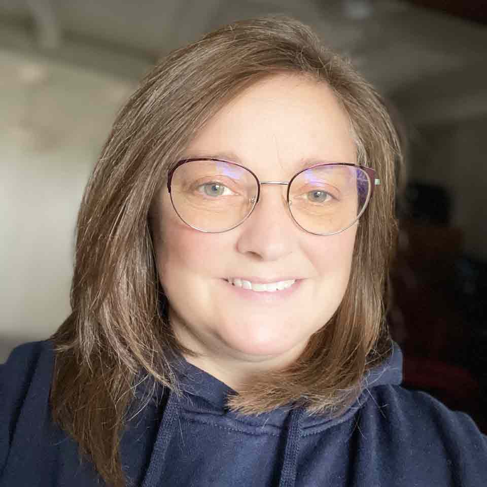 Dr Victoria Nolan, seen smiling and wearing glasses