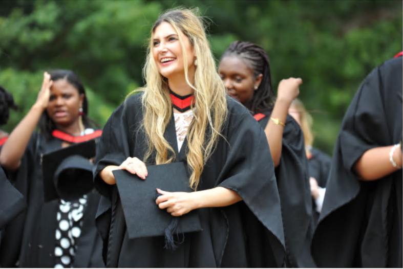 Essex Law graduates smiling after the graduation ceremony in their robes