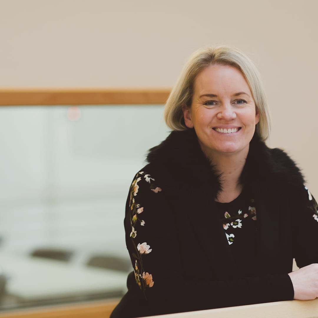 Chloe Warren standing in Essex Business School 