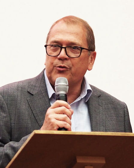 Bryn Morris speaking at an awards ceremony