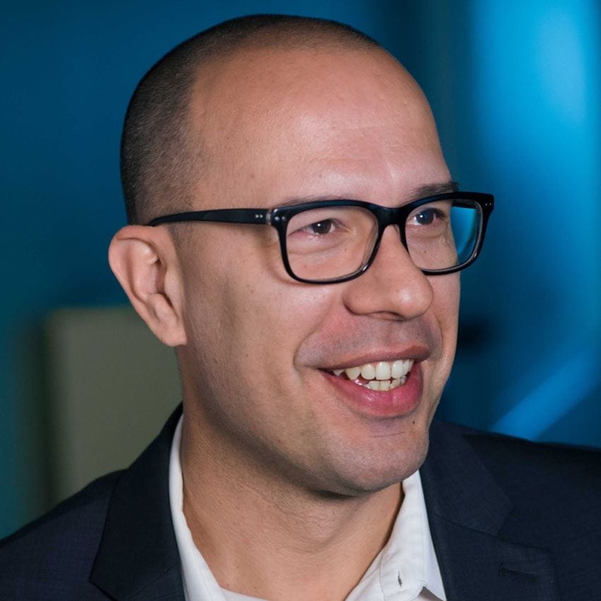 Profile picture of a man in glasses looking to the right of the camera