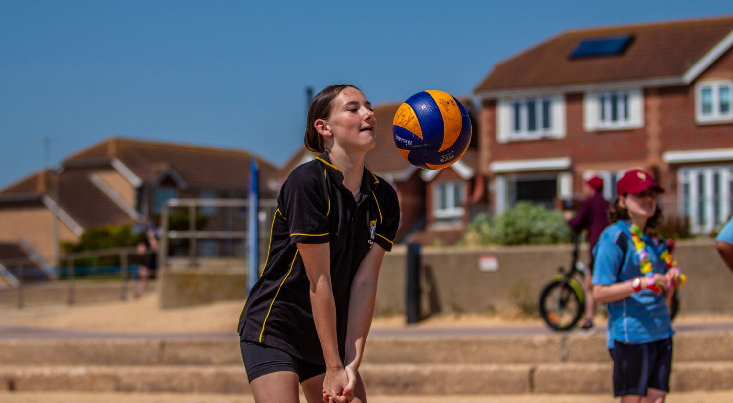A Clacton Coastal Academy Student digs the ball