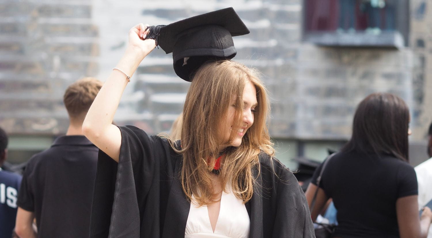 A young graduate enjoys the day