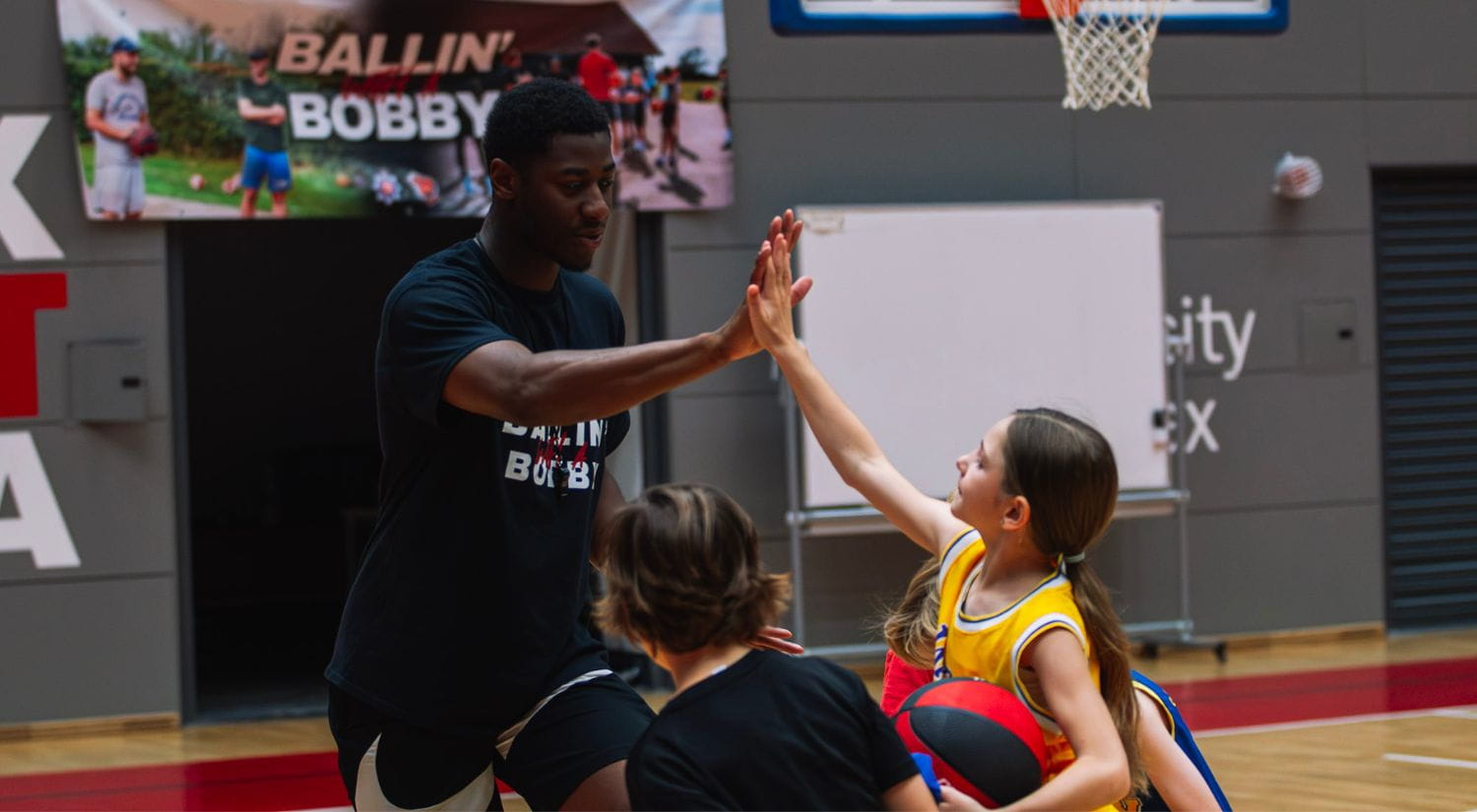 Essex Rebels ace Tyreese Hudson high fives children