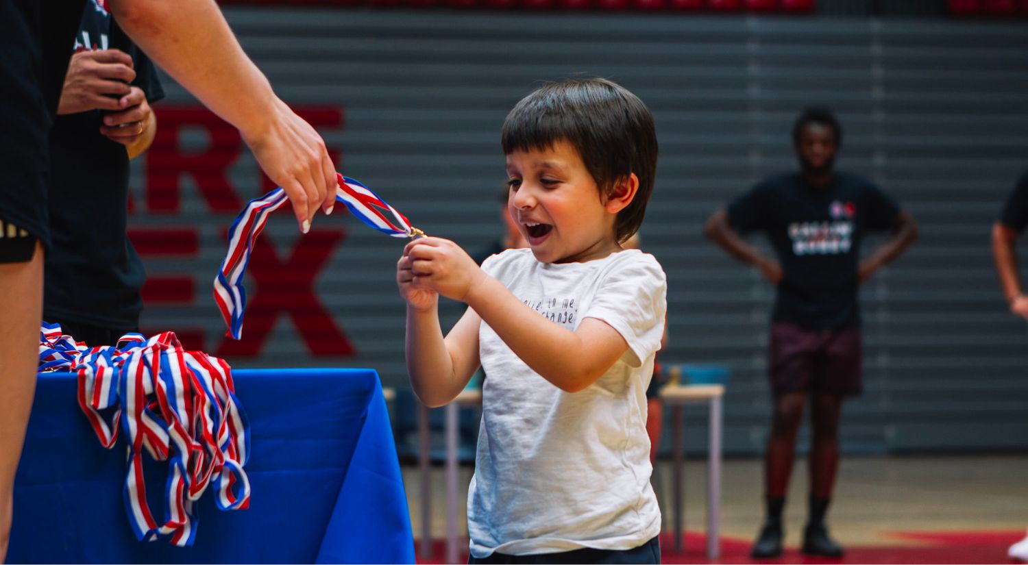 Big grins as the children get their medals