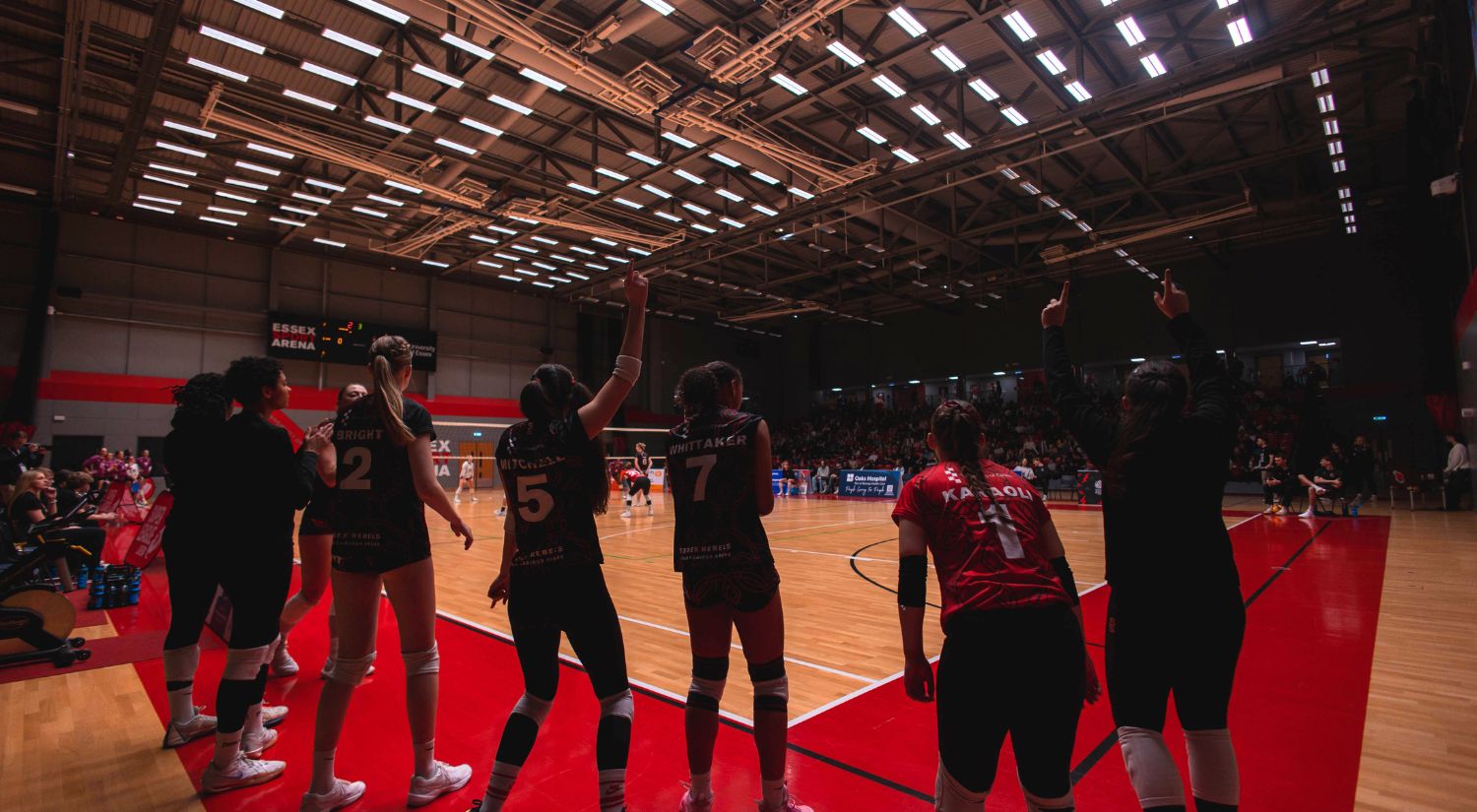 The women's bench cheer on the team during the record-breaking day