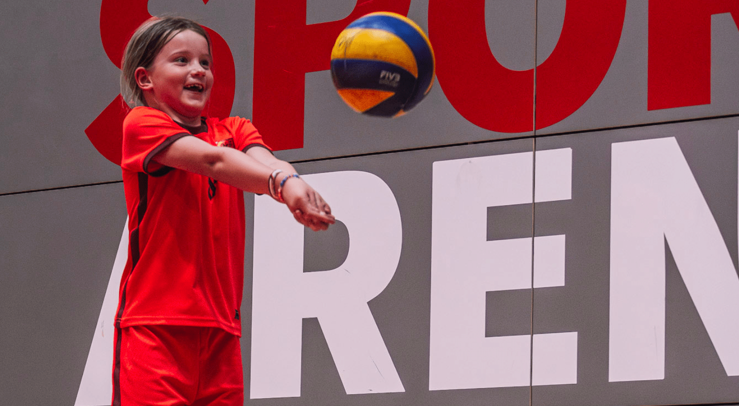 Junior hitting a volleyball into the area