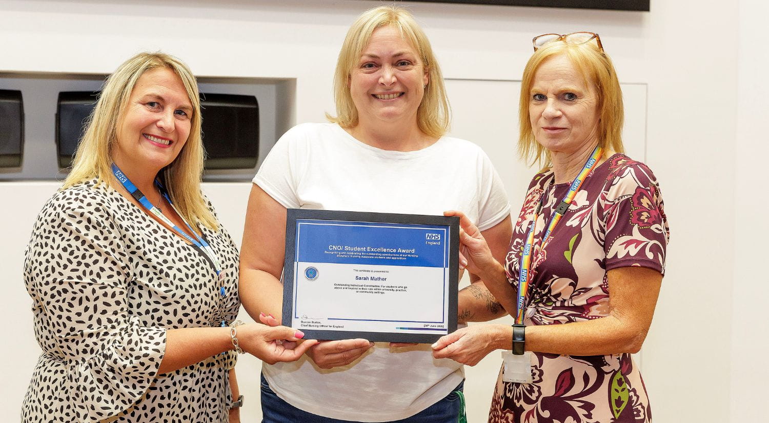 Sarah Mather receives award from Louisa White and  Frances Bolger