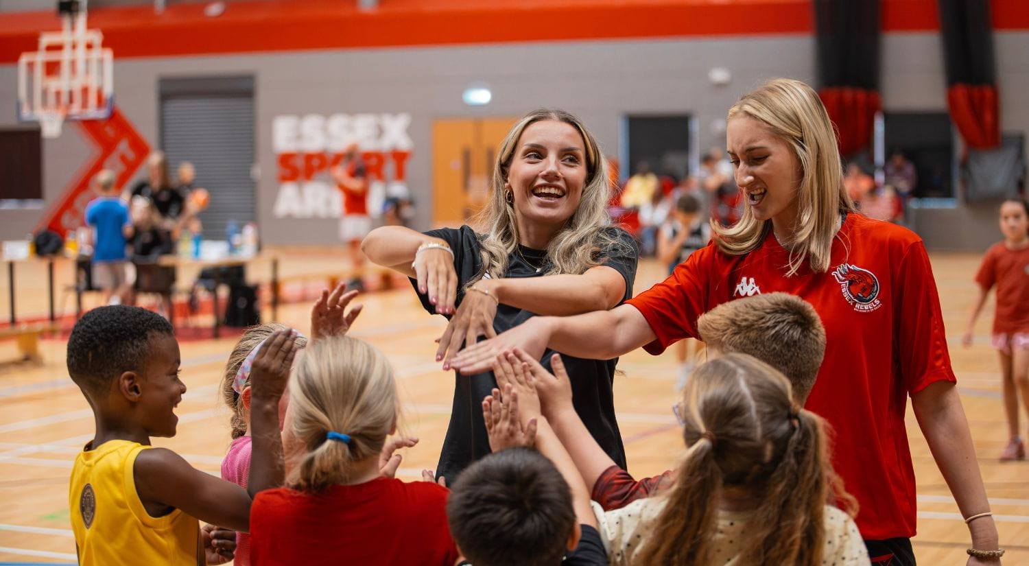 GB international Liv Forster and Rebels teammate Amba Thompson entertain the kids