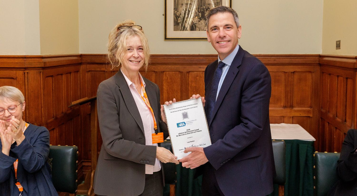 Professor Lucy Noakes receiving her award from Chris Evans MP photographer Simon O'Connor