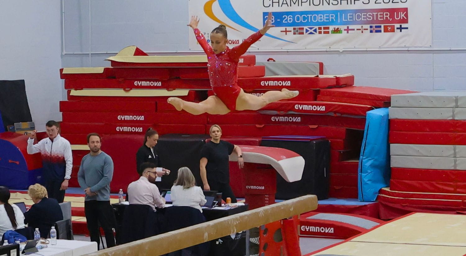 Abigail jumping high on the Beams