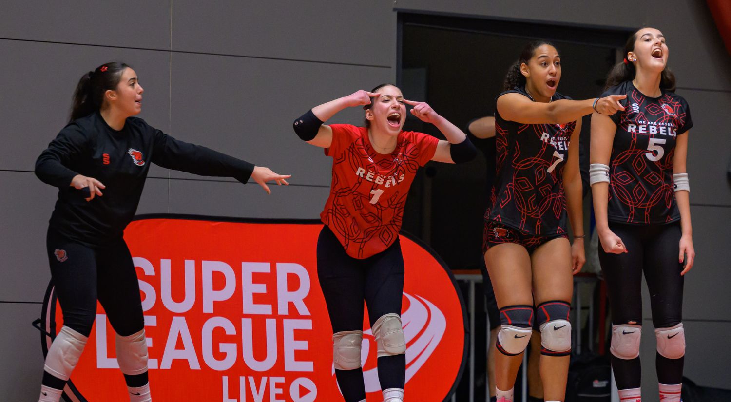 The women cheer on their teammates