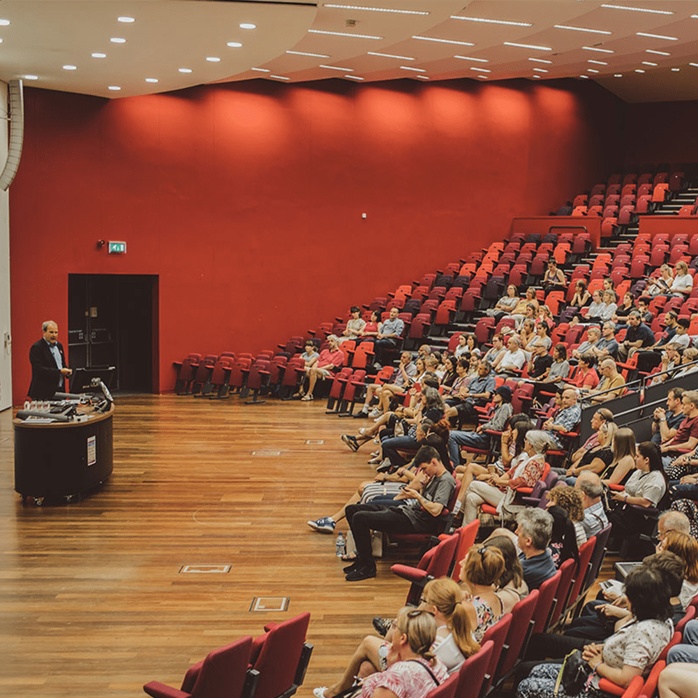 A lecture being held in the Ivor Crewe building, University of Essex, with students listening.