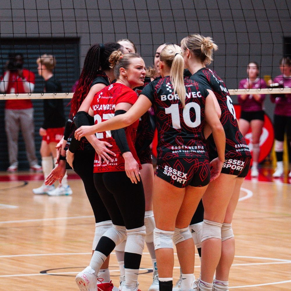 Rebels Women's Volleyball - Plays huddled together