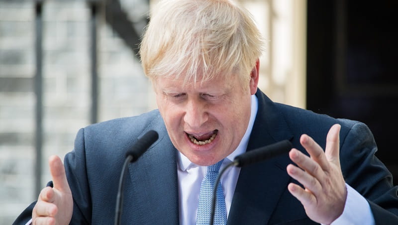 Boris Johnson outside Number 10 Downing Street giving a speech and gesturing with his hands