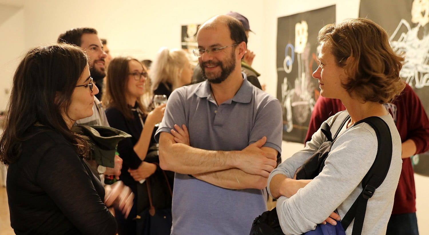 Carlos Gigoux and Renee Luthra attending an art exhibition hosted by the Centre for Migration Studies.