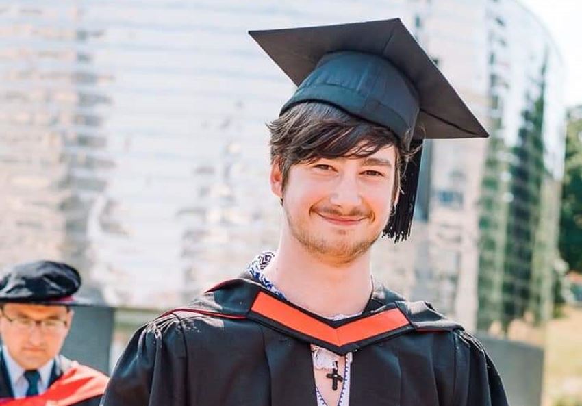 Photograph of a Q-Step graduate in mortar board and gown
