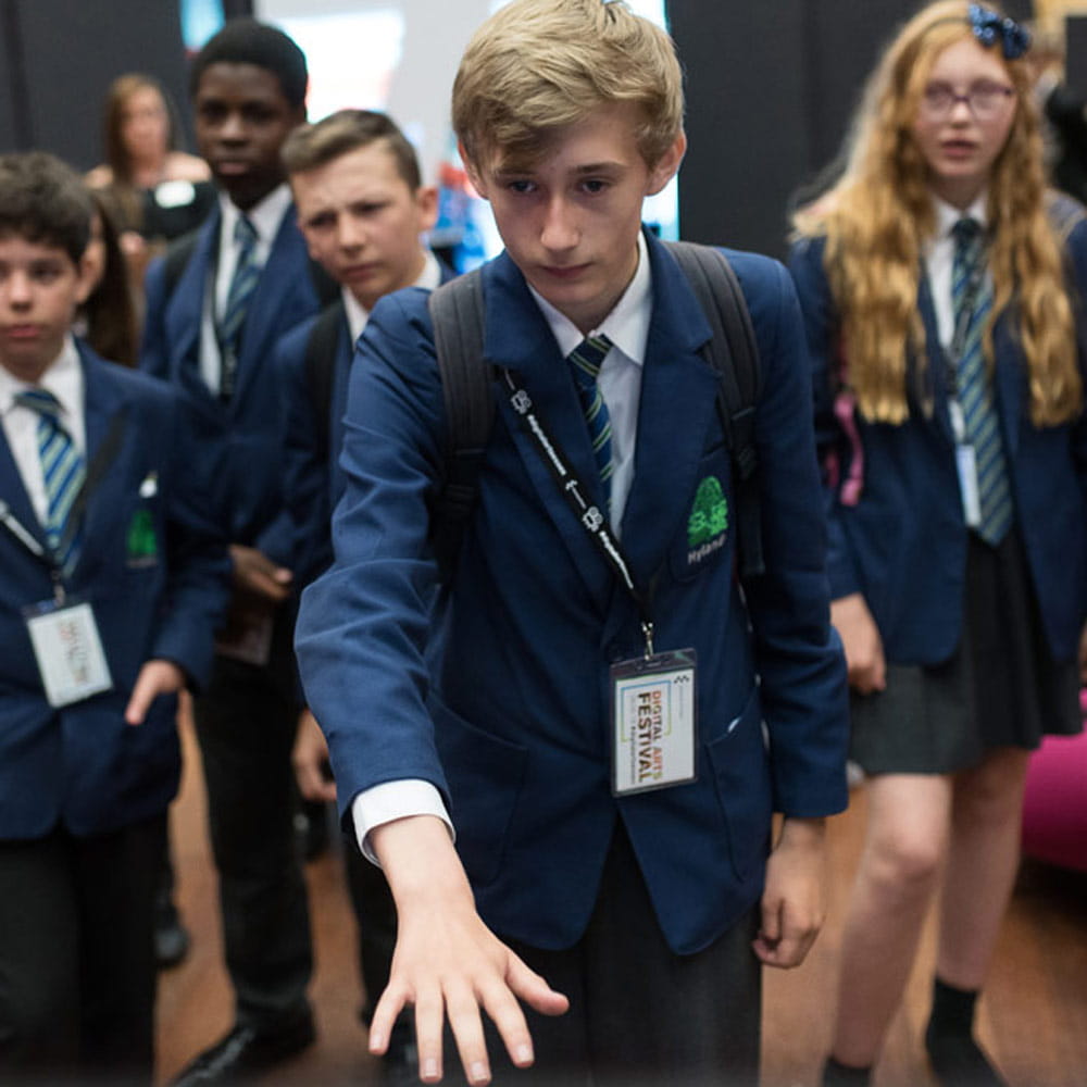 Student interacts with technology at Digital Arts Festival 