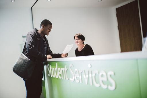 A student visiting student services