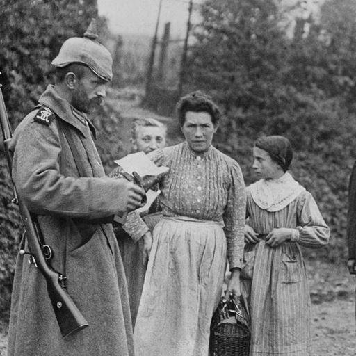 German soldier inspects documents of women in occupied France, First World War