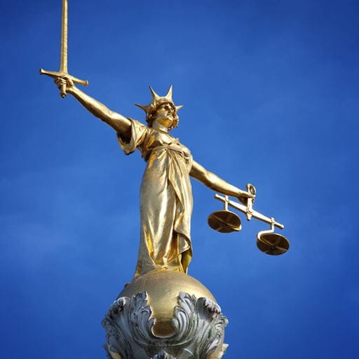 Justice statue on top of Old Bailey in London