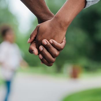 Man and woman holding hands