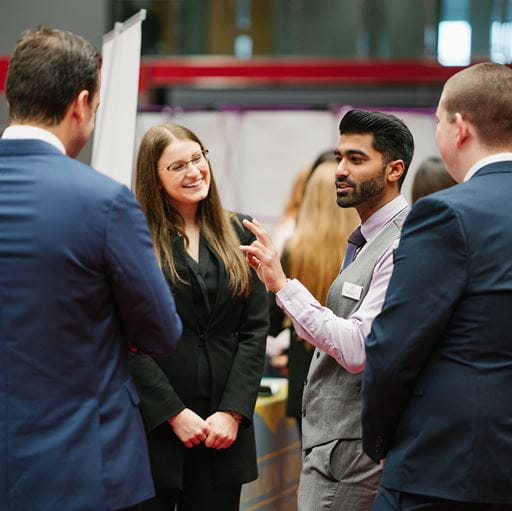 A student talks to an exhibitor at the Edge Hotel School Careers Fair 2019.