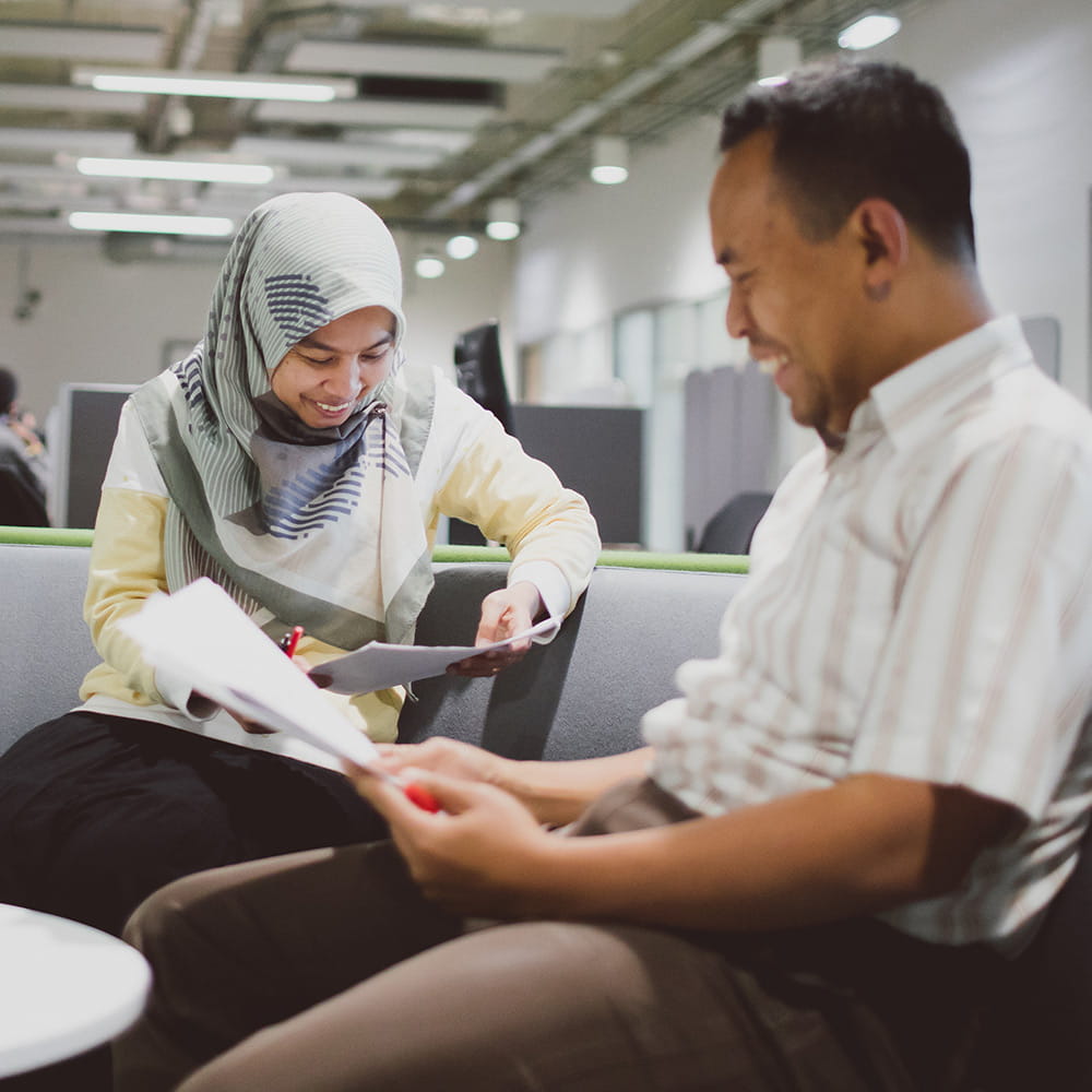 A research student and a lecturer working together
