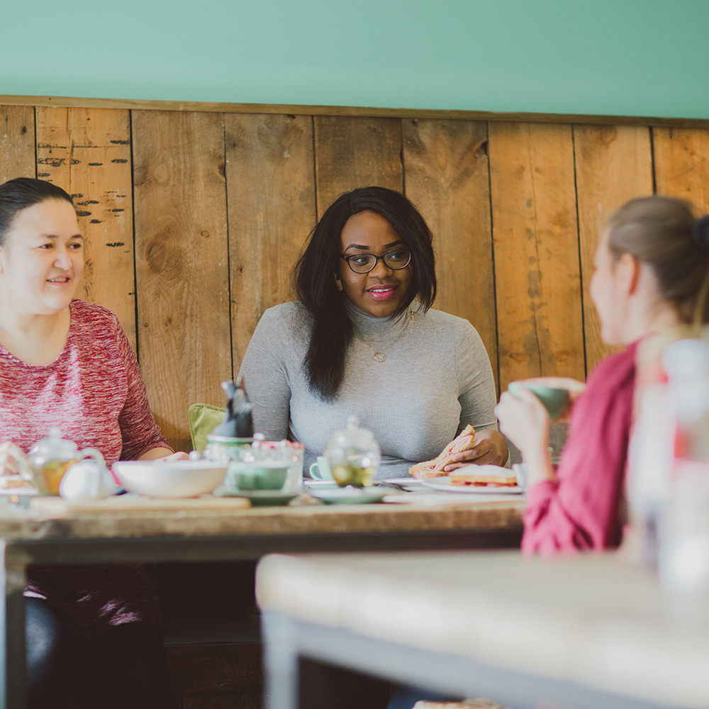 Three women sat in a cafe in colchester