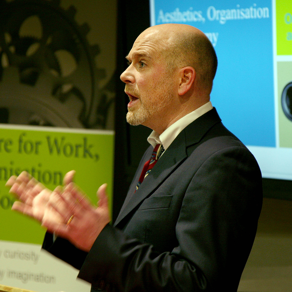 A speaker delivers a keynote speech at the Centre for Work, Organisation and Society (CWOS) launch event.