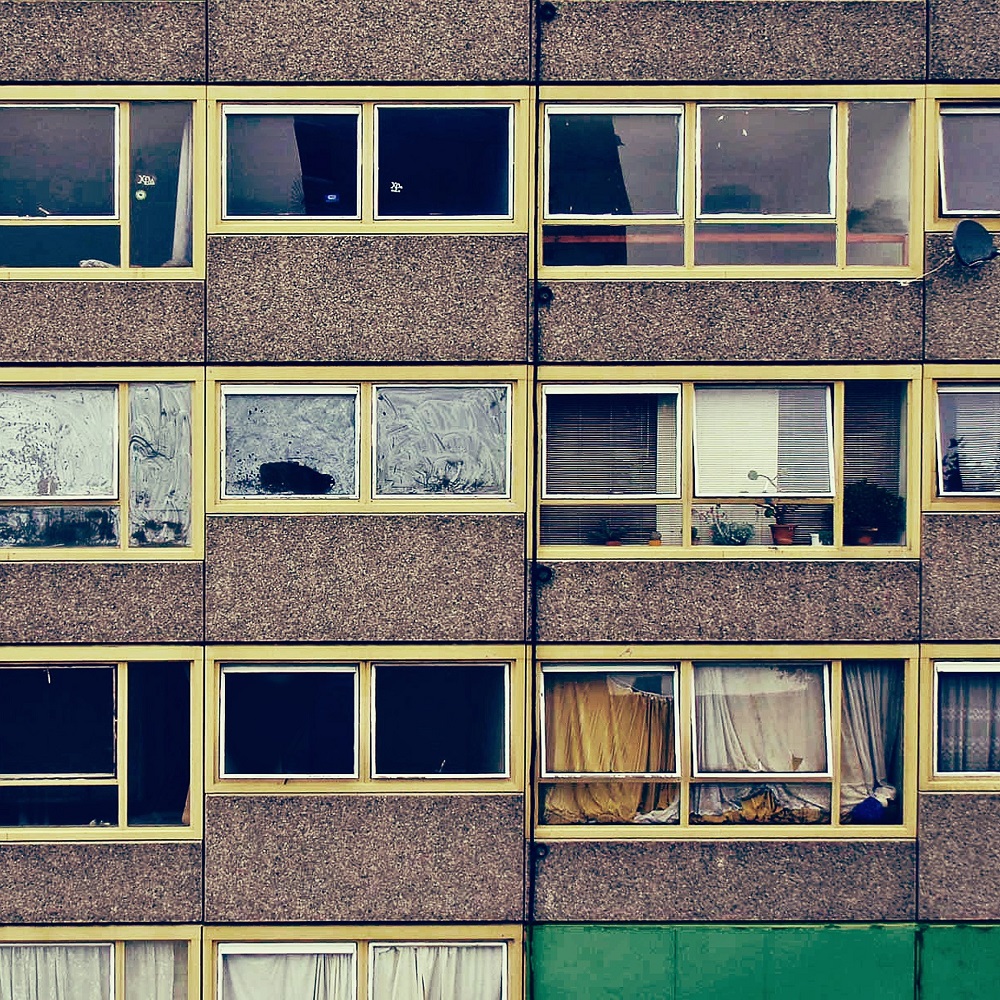 A block of flats with broken windows