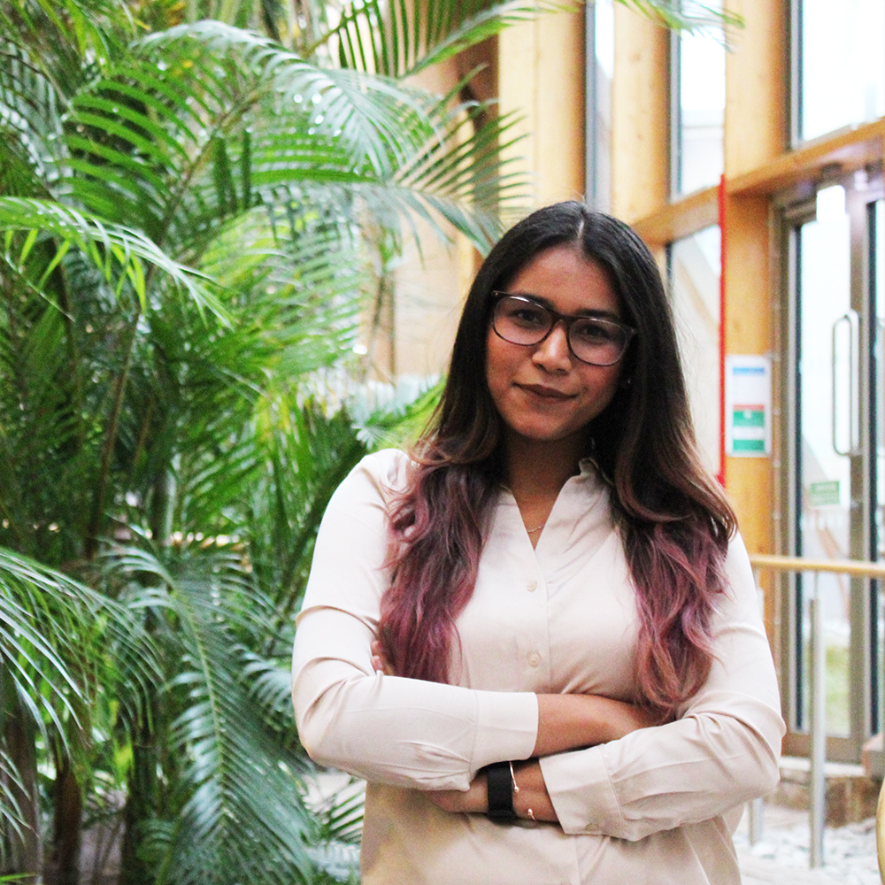 MBA 2020 student, Parina Jain, stands in the Essex Business School winter garden.