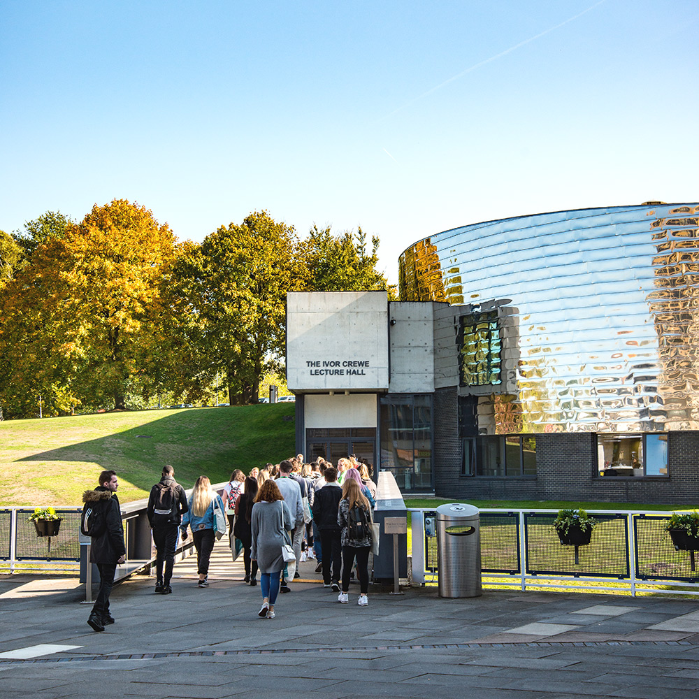 Image of the Ivor Crewe Lecture Hall with people walking in and out