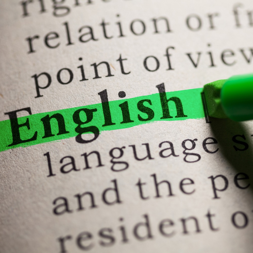 A page from an English dictionary with the word English highlighted in green highlighter pen.