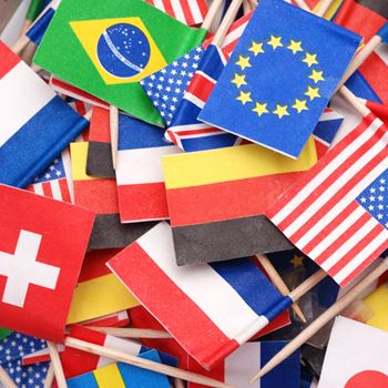 Lots of different national paper flags on cocktails sticks.