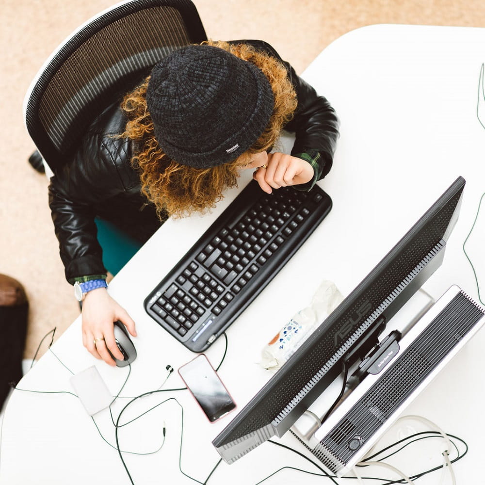 Person sat at computer, photo taken from above