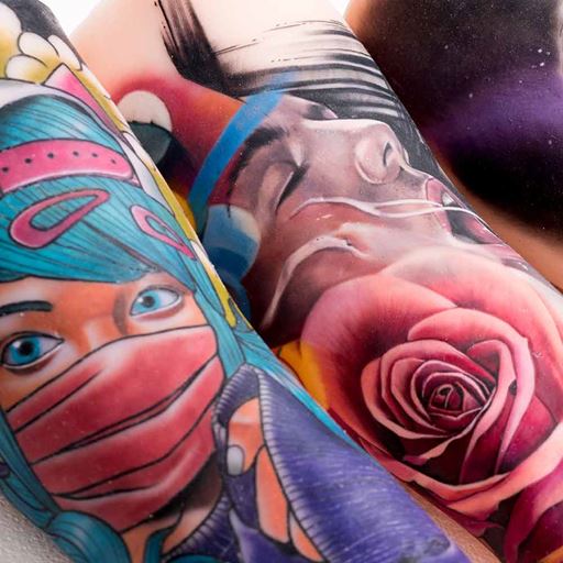 Colourful faces tattooed on forearms