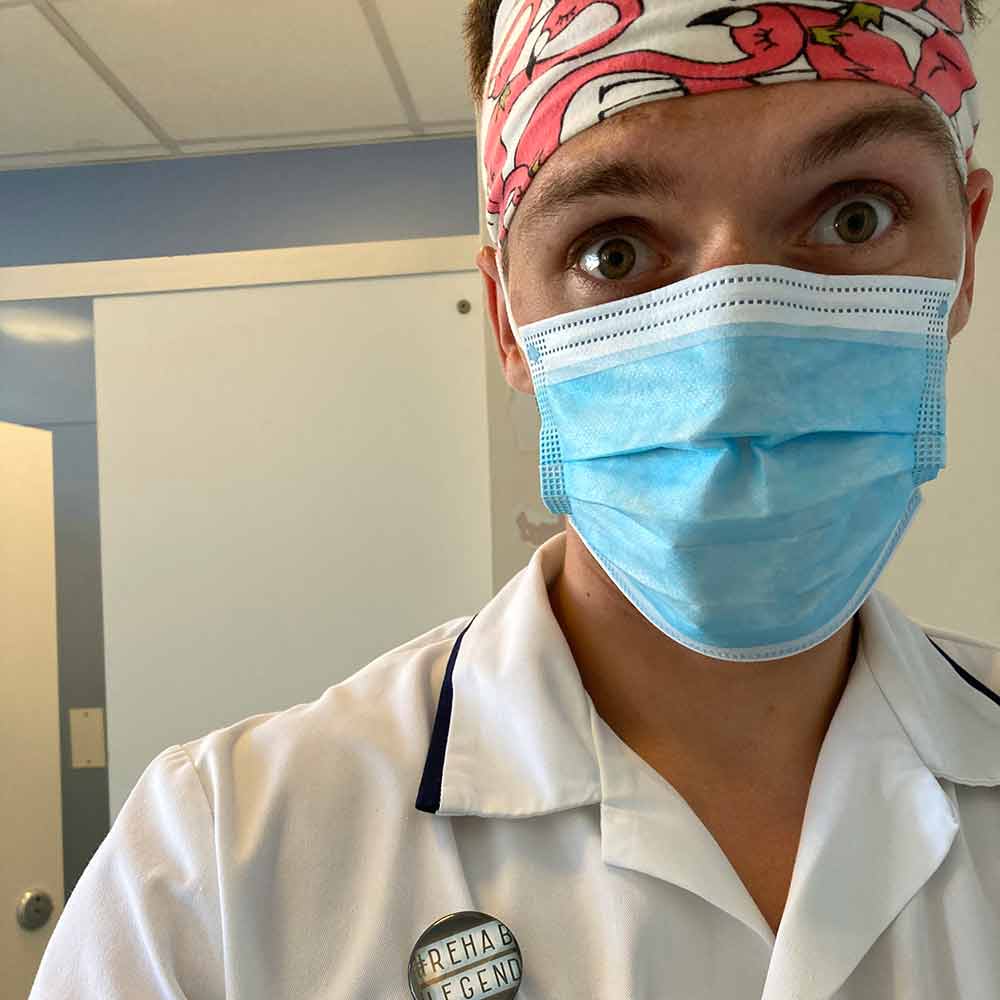 Sam Nelson, wearing a protective blue face mask and a colourful pink and red bandana on his head