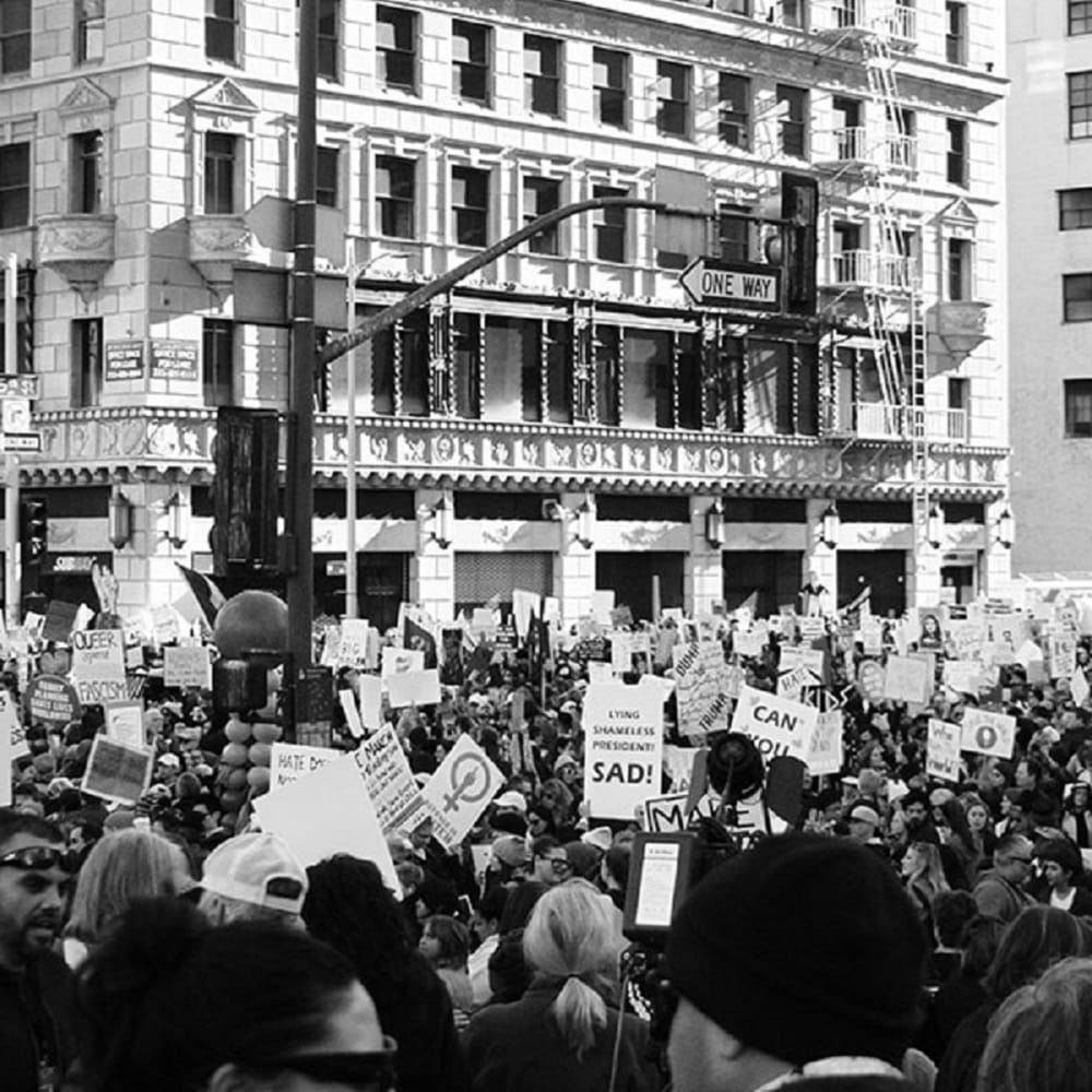 A black and white photograph of a political rally.