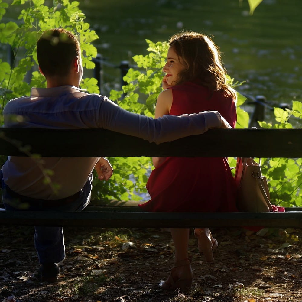 couple sitting on bench